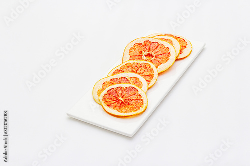Dried slices of grapefruit isolated on white background