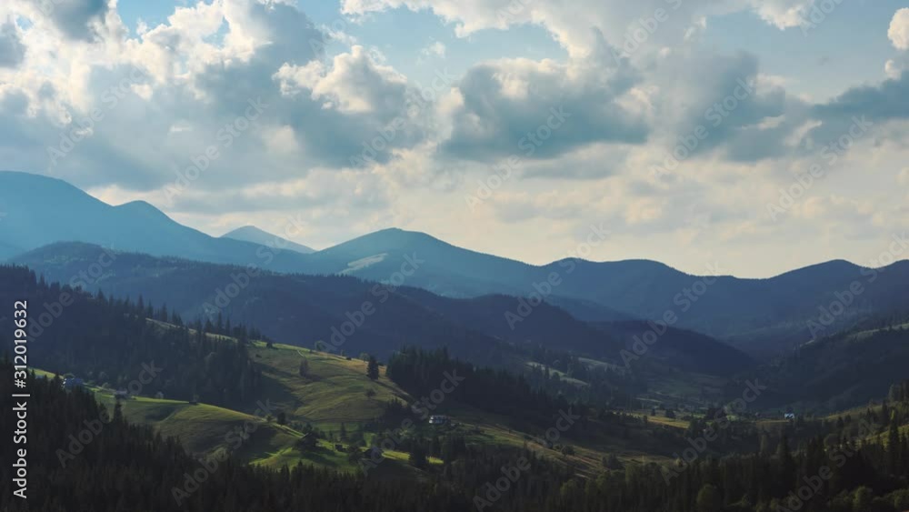 Timelapse of clouds passing by mountain range in sunny day Timelapse of clouds passing by mountain range in sunny day