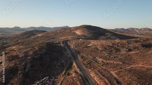 4K high quality sunny morning aerial panorama footage of spectacular scenic Springbok town, set among rocky mountains in Northern Cape province, South Africa near the border with neighbouring Namibia