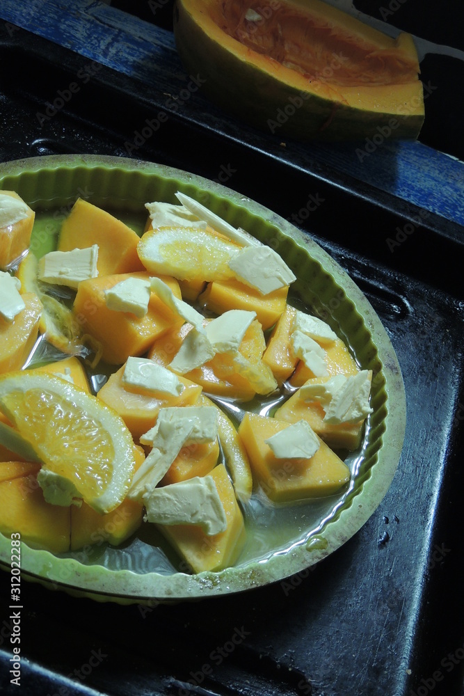 pumpkin with butter and orange in the oven pumpkin with butter and orange in the oven