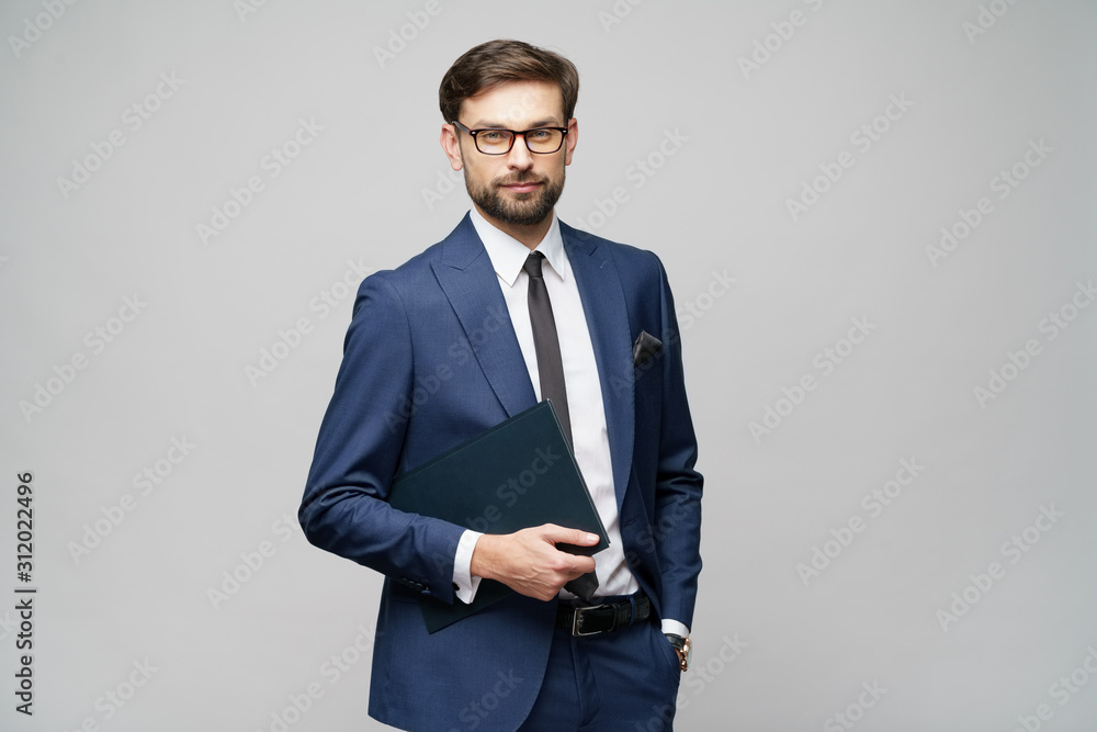 © Anatoly Repin - Portrait of a handsome young business man holding document folder