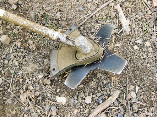 Knife on the trimmer for cutting grass and bushes photo