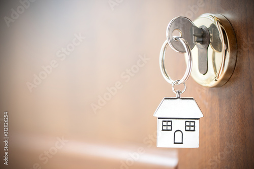 House key in the door. photo