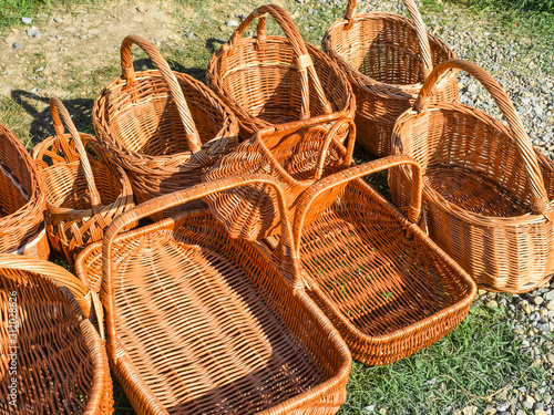 Several wicker baskets on the ground photo