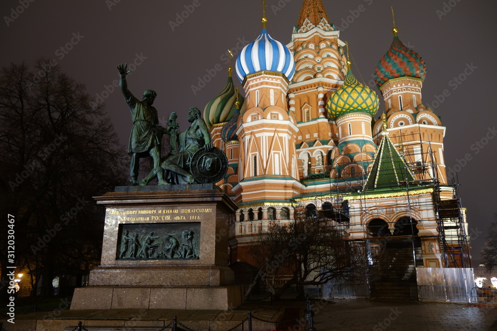 minin and pozharsky monument and st basils cathedral on red square in moscow at night in winter