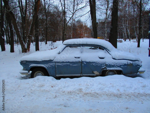 vintage russian car abandoned in snow in winter