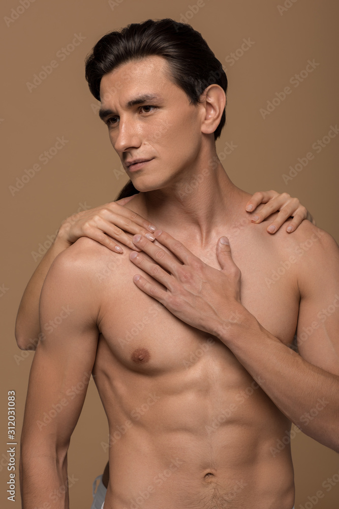 sensual girl hugging handsome boyfriend isolated on beige sensual girl hugging handsome boyfriend isolated on beige