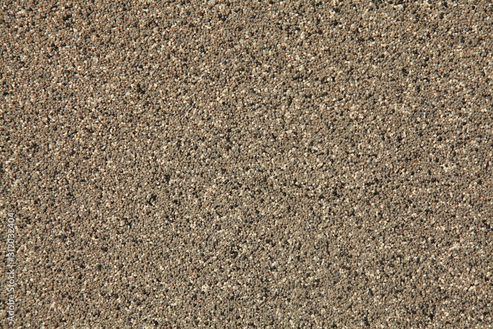 Mosaic and granulated textured coating, texture, background. Structural plaster, rough, uneven surface in brown color. Modern exterior cladding of multi-story buildings Mosaic and granulated textured coating, texture, background. Structural plaster, rough, uneven surface in brown color. Modern exterior cladding of multi-story buildings