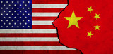 USA flag and China flag on cracked wall.