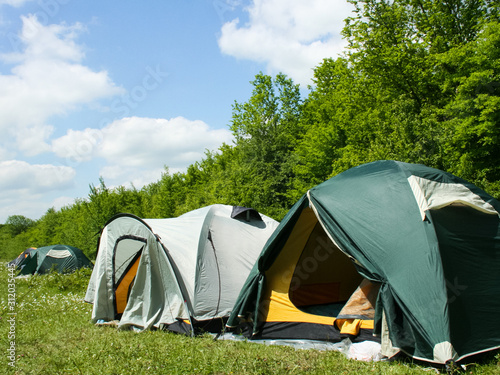 tourist tents in forest at campsite © eleonimages