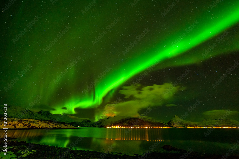 Dramatic polar lights, Aurora borealis over the mountains in the North of Europe - Lofoten islands, Norway