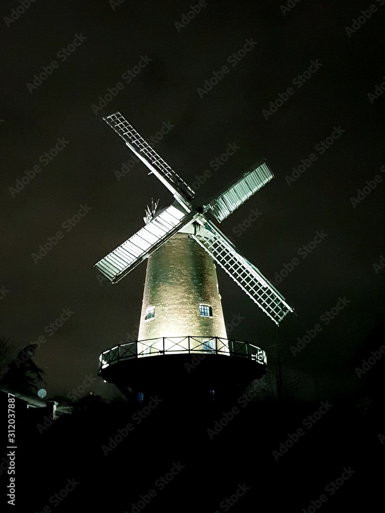 old windmill on background of blue sky