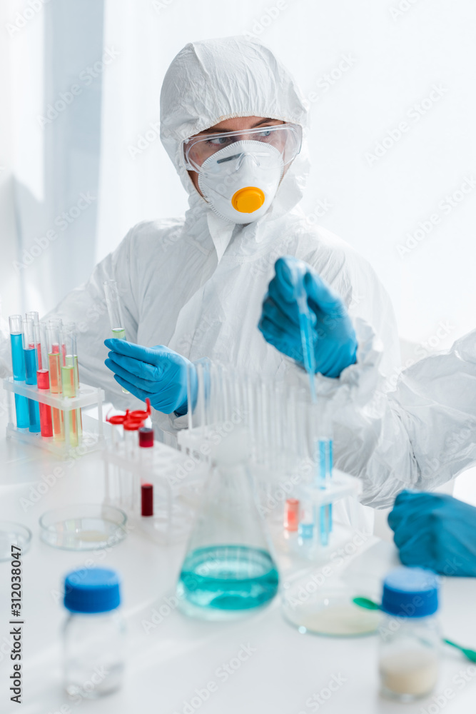 cropped view of scientists in latex gloves doing dna test in lab cropped view of scientists in latex gloves doing dna test in lab