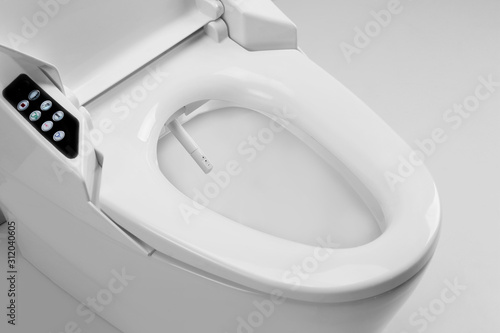 Toilet bowl with electronic high technology. White toilet bowl. Japan toilet electronic control bidet.