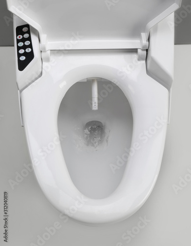 Toilet with electronic high technology. White toilet bowl. Japan toilet electronic control bidet.