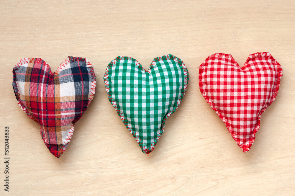 Gingham Love Valentine's hearts. on wooden background Gingham Love Valentine's hearts. on wooden background