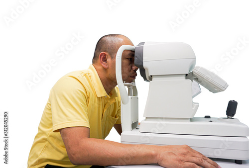 Asian man ophthalmologist to check quality of eye vision. photo