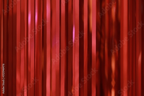 red ribbons curtain closeup for background