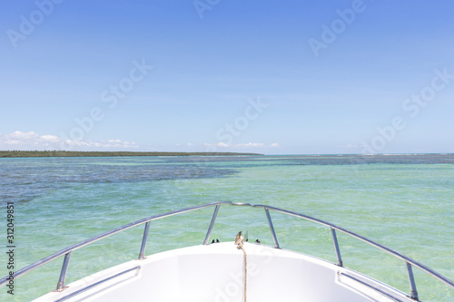 Top view of a yacht boat from natural pools in blue sea in Morro de Sao Paulo  Bahia  Brazil.