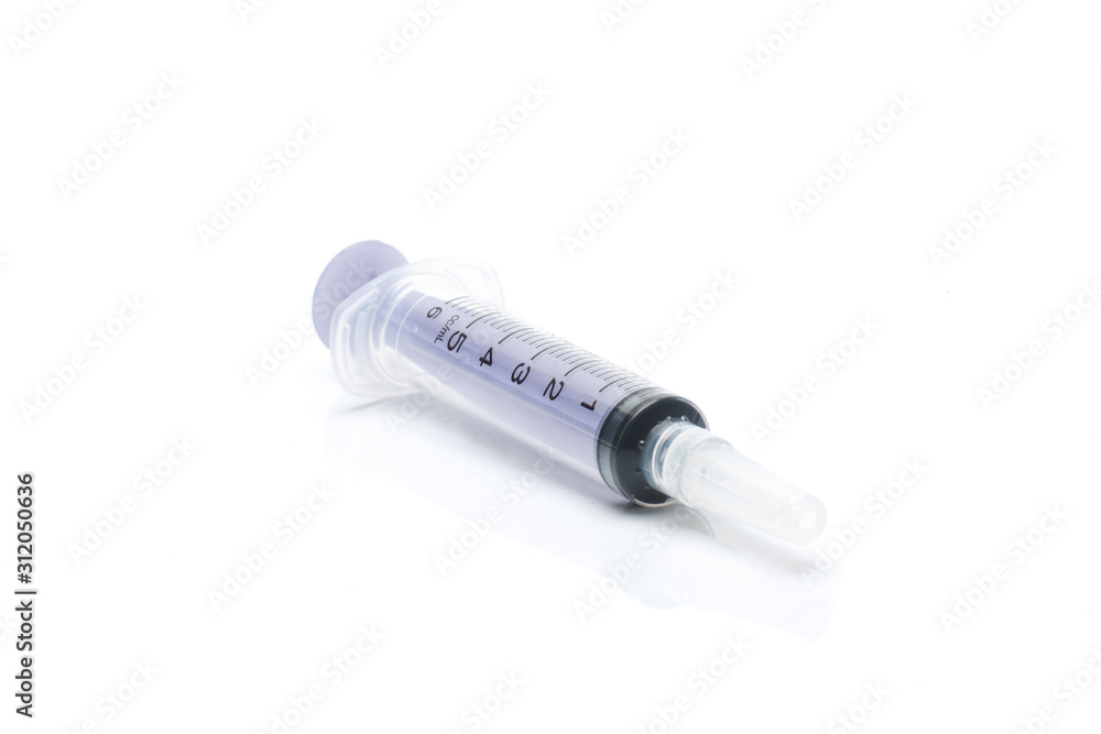 Closeup of a transparent oral syringe for children's medicine, isolated on white background Closeup of a transparent oral syringe for children's medicine, isolated on white background