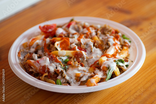 kebab with french fries in a dish 