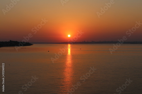 Beautiful sun over the horizon of the river