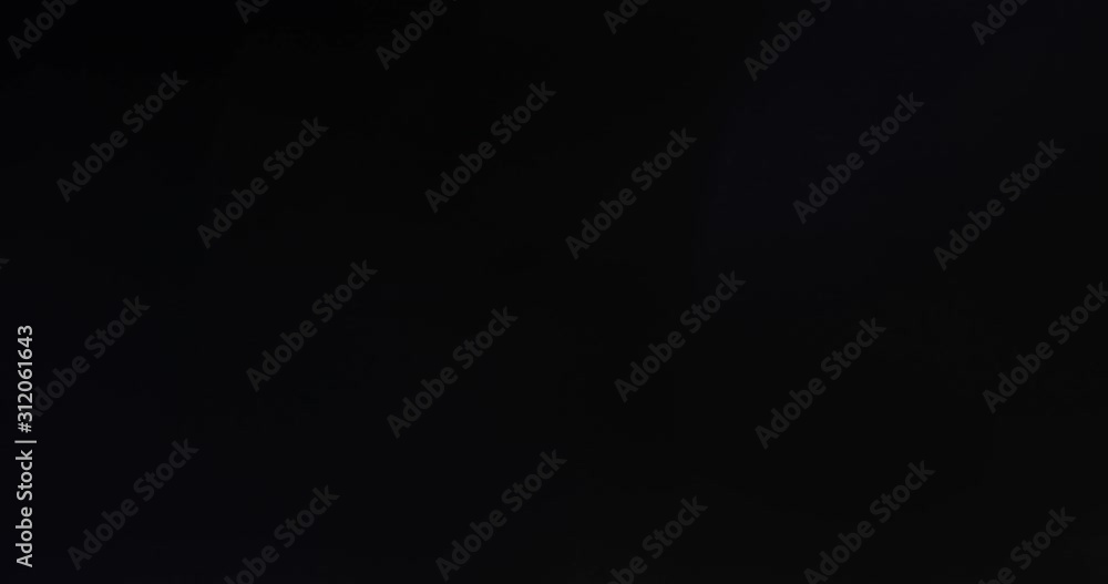 Abstract bokeh light background for overlay. Real Lens flare light effect. Sparkle ray leak on black background. Abstract bokeh light background for overlay. Real Lens flare light effect. Sparkle ray leak on black background.