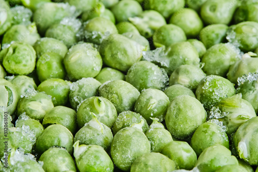 Healthy Food. Frozen green peas with pieces of ice, some sprouted. Shallow focus. Close-up. Macro. Healthy Food. Frozen green peas with pieces of ice, some sprouted. Shallow focus. Close-up. Macro.