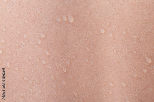 drops of water on human skin 