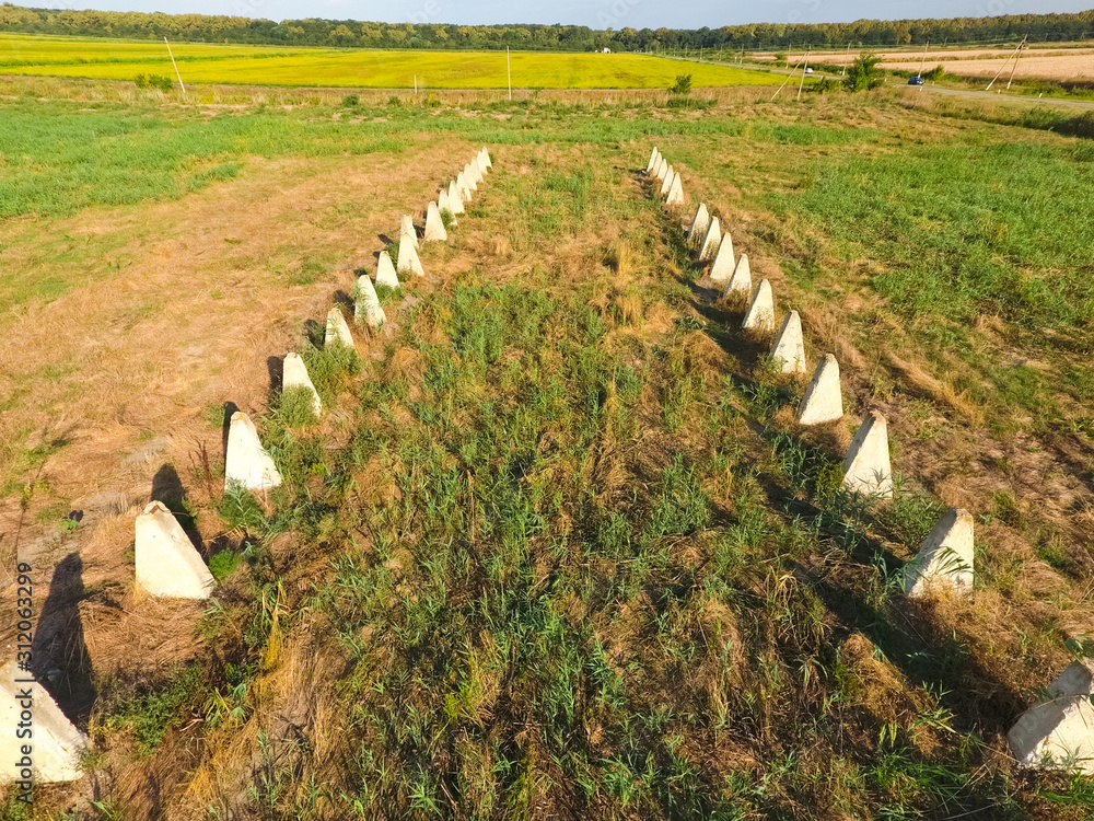 Obraz premium The ruins of the old farm. Cones column base of the wall. Abando