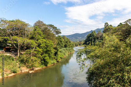 The Mahaweli River flowing along the Royal Botanical Gardens, Peradeniya, Central Province of Sri Lanka