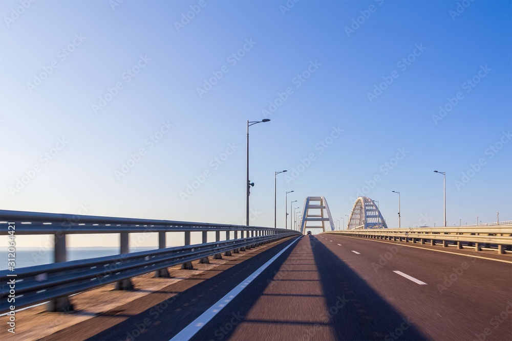 view of the road communication of the Crimean bridge from a moving car on a summer day