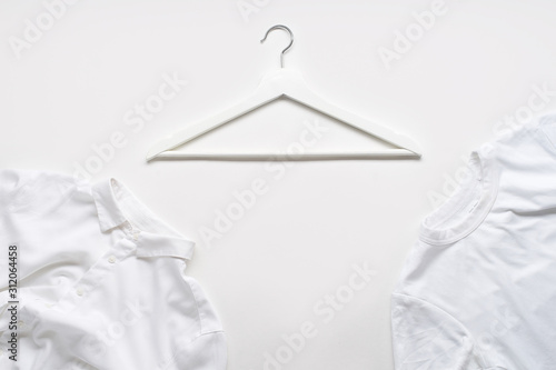 White monochromatic flatlay on white background with shirt and t-shirt. Blog design concept © Anastasiia Nurullina