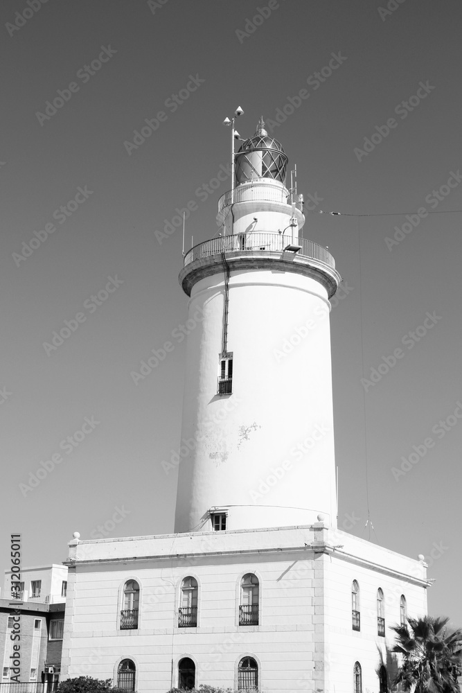 Malaga lighthouse. Vintage toned black and white style.