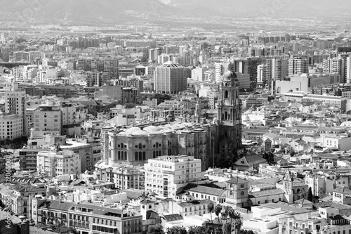 Malaga city in Spain. Vintage toned black and white style.
