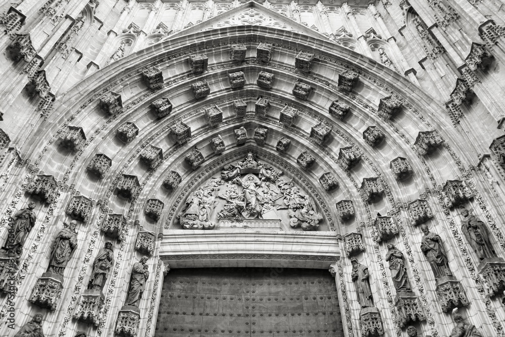 Seville Cathedral door. Vintage toned black and white style.