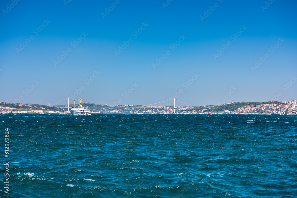Beautiful view of Bosphorus bridge cross the Bosphorus strait, Istanbul, Turkey, view on a cruise ship sailing on the strait Bosphorus strait.