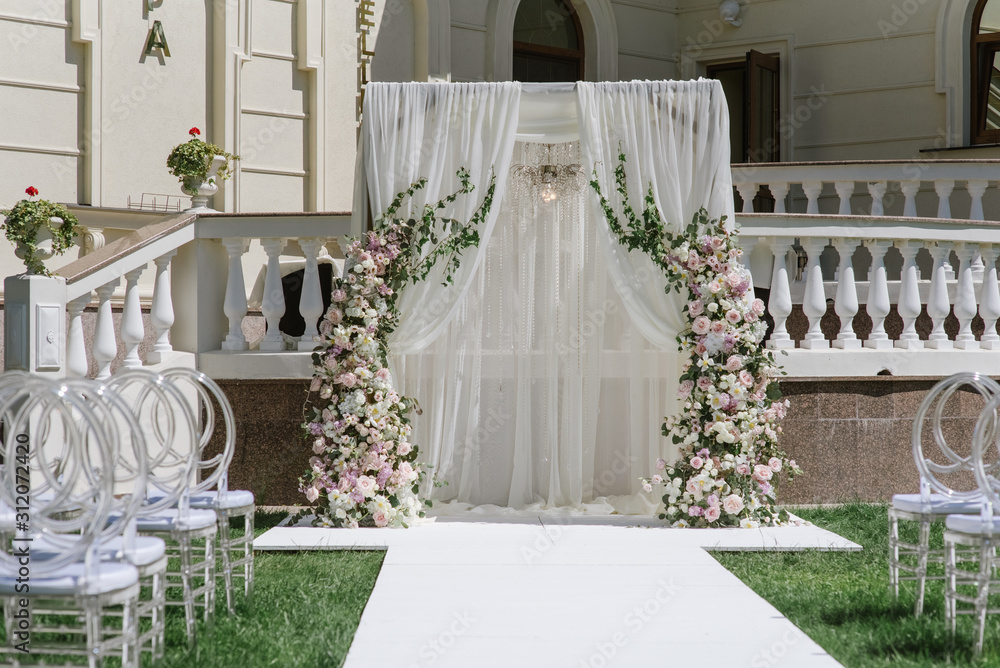 A large rectangular arch adorns the area for the marriage ceremony