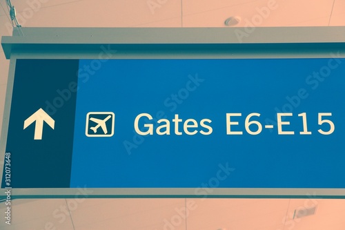 Airport signs to gates. Vintage filter color tone.
