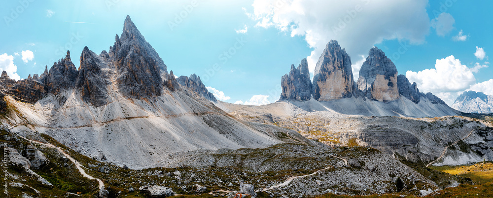 Awesome Alpine highlands in sunny day. Majestic World famous peaks of Tre Cime di Lavaredo National park. Awesome Nature Landscape. Best beautiful place in the World. Amazing Natural background