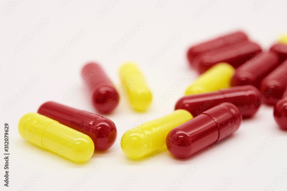 Yellow and red capsules isolated Yellow and red capsules isolated