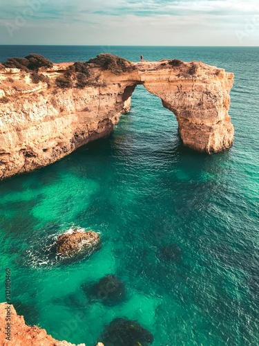 The famous cliffs and rocks in the ocean from a viewpoint over the ocean at sunset light. Perfect spot for travel ideas in europe. Farol da Ponta da Piedade, Lagos, Faro, Portimão, Algarve, Portugal