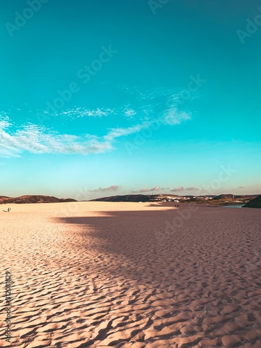 Beautiful endless sand beaches on a sunny warm day with soft sunset light. Praia da Bordeira at the Algarve Coast in Portugal  Atlantic Ocean