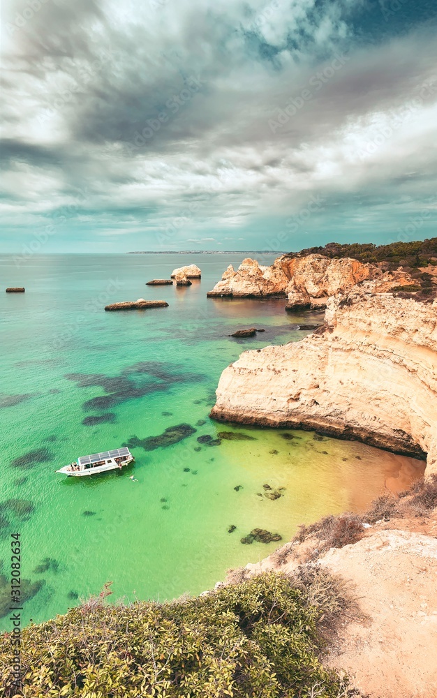One of the must visit spot at the famous coastline with rocks and beautiful beaches at sunset light Praia da Marinha, Famous Beach, Algarve Coast, Lagoa, Portimao in South Portugal, Atlantic Ocean