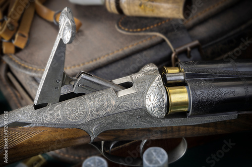 hunting rifle with an unusual reloading system and beautiful engraving
