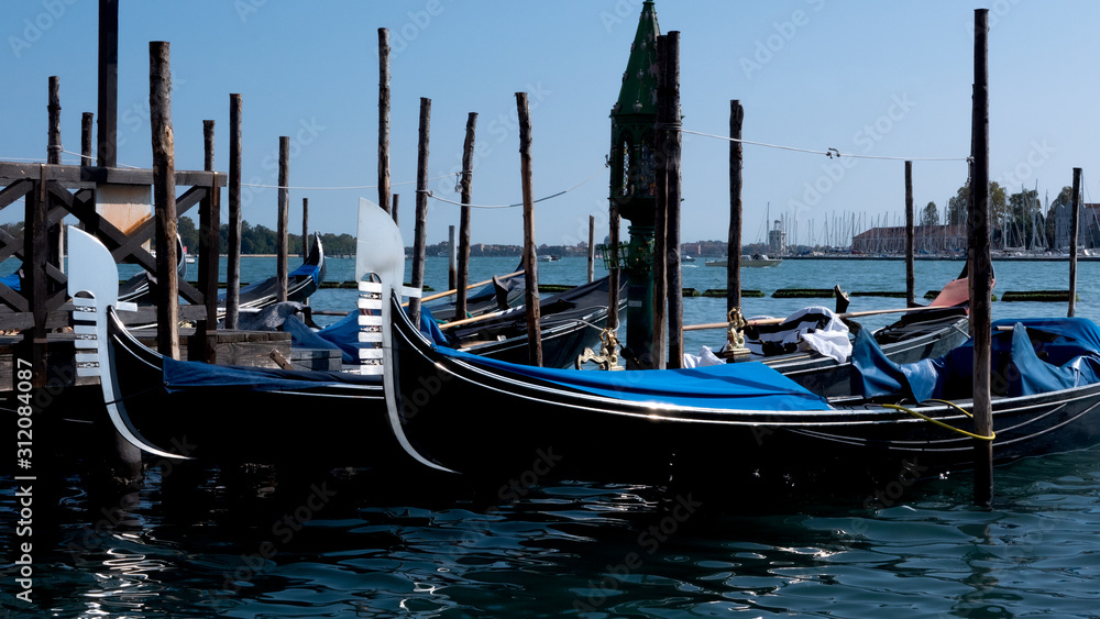 Parked gondolas on the Grand canal of Venice, Italy.