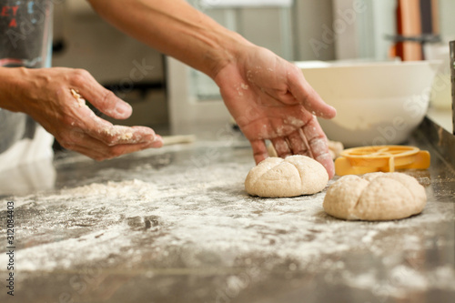 hands crumple dough, 
