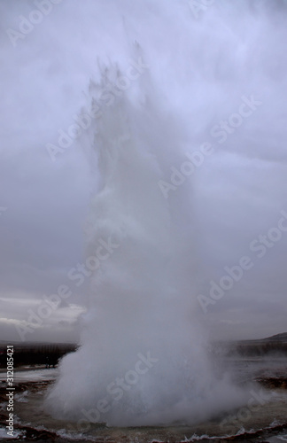 Blurred. The eruption of the Strokkur geyser in the southwestern part of Iceland in a geothermal area near the river Hvitau