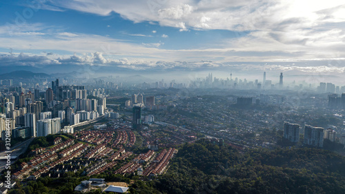 Beautiful aerial view of downtown at Kuala Lumpur, Malaysia skyline with urban skyscrapers during cloudy sunrise