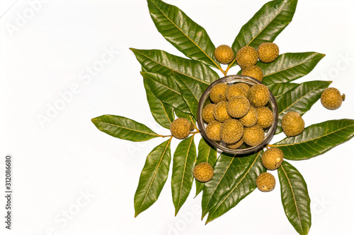 Top view of Dimocarpus longan.A bunch of Longan fruits with green leaves on white isolated background. photo